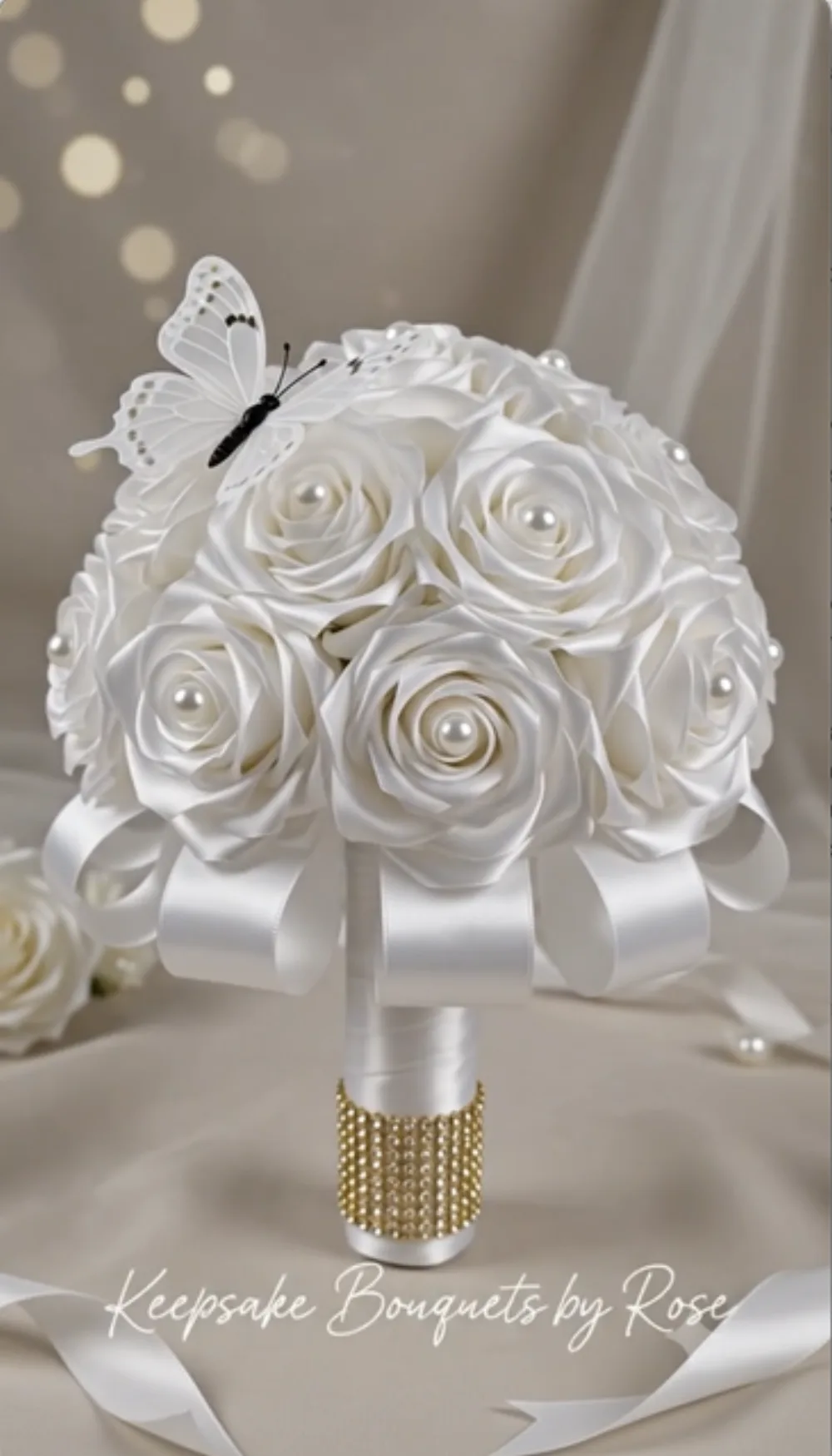 White satin rose bridal bouquet with pearls and gold rhinestone handle